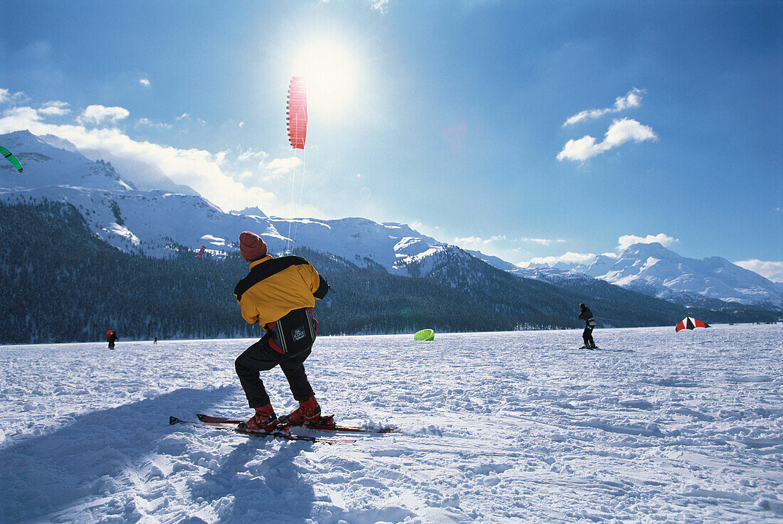 A man snowkiting at Lake Sils, Winter sport, Engadin, Switzerland