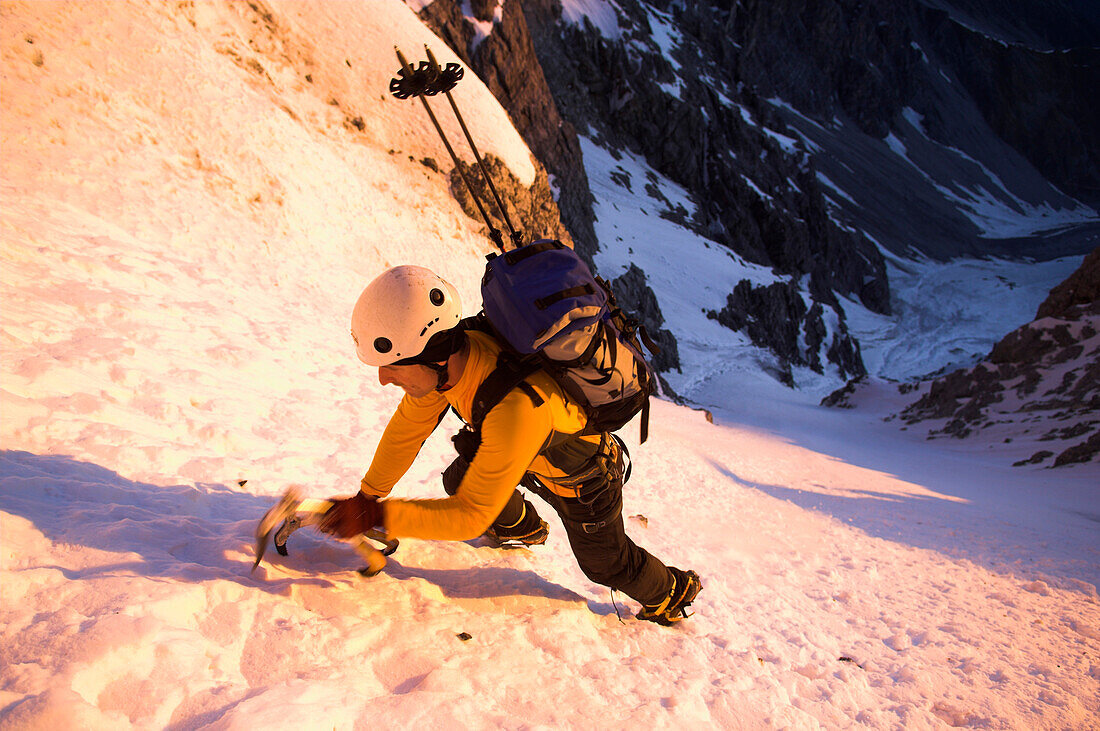 Mountaineer climbing north wall of mount Ortler, Trentino-Alto Adige, Italy