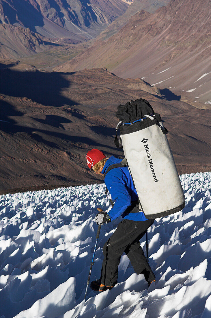 Man descending via an ice field, Cajon del Maipo in the background, Ice Climbing, Chile