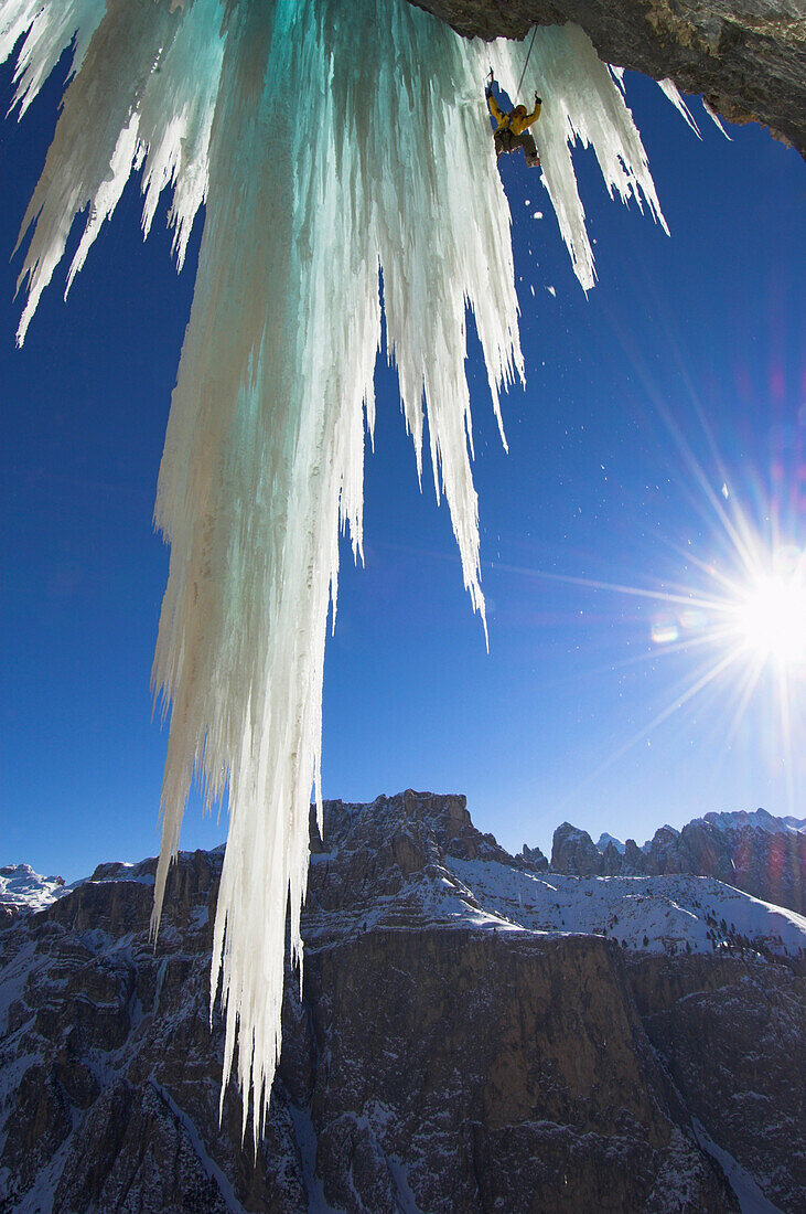 Ice climber on icy rock face, Langental valley, Dolomites, Trentino-Alto Adige, Italy