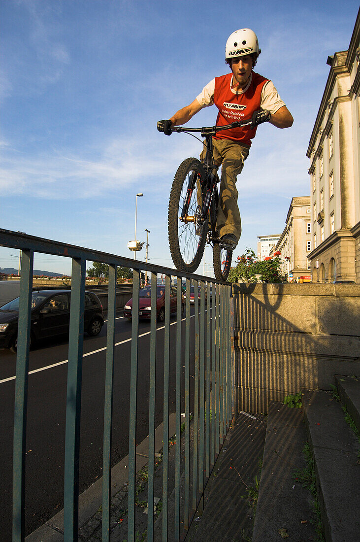 Biker driving over metal gate, Linz, Upper Austria