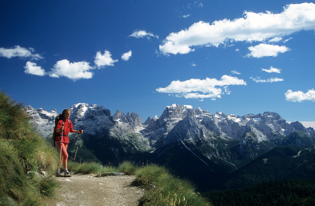 Hiker in front of Brenta Range, Cinque Laghi, Italy