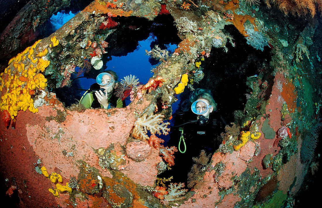 Two Scuba diver examine ship wreck Liberty, Bali, Tulamben, Indian Ocean, Indonesia