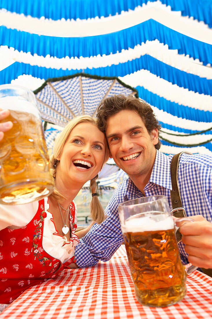 Couple with beer in a beer tent