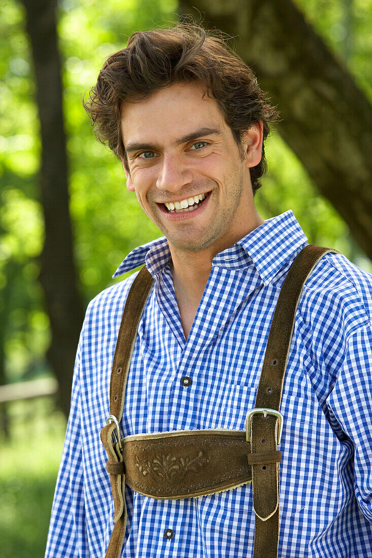 Mid adult man smiling at camera