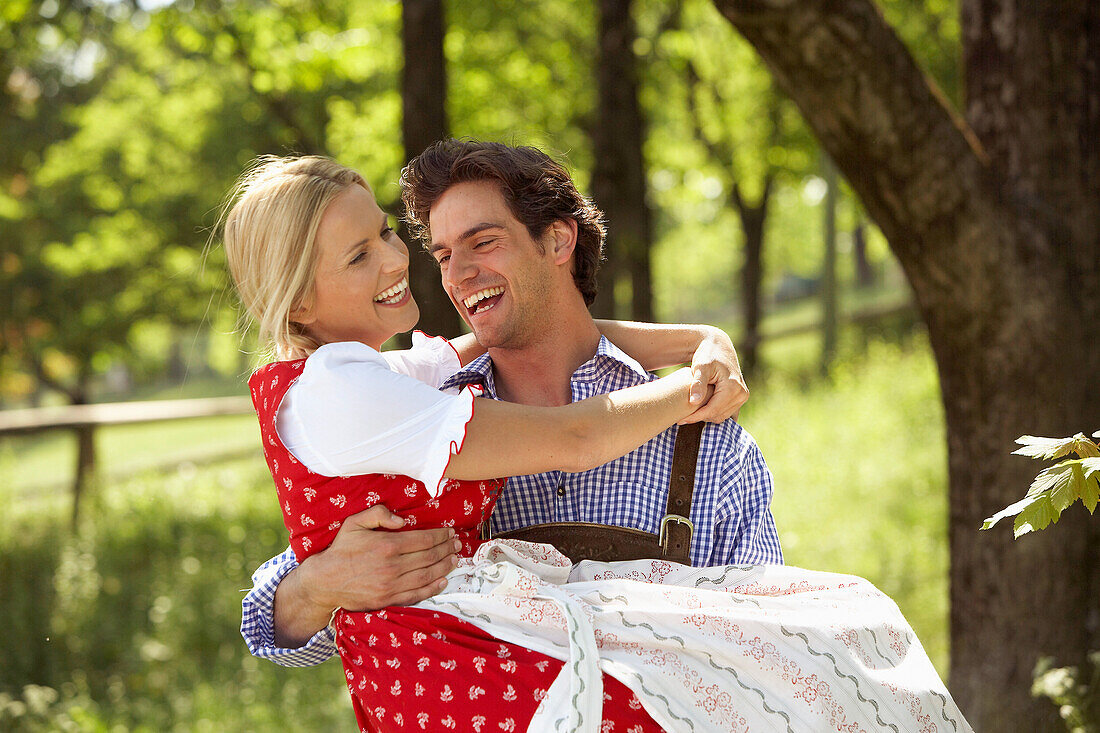 Man carrying woman