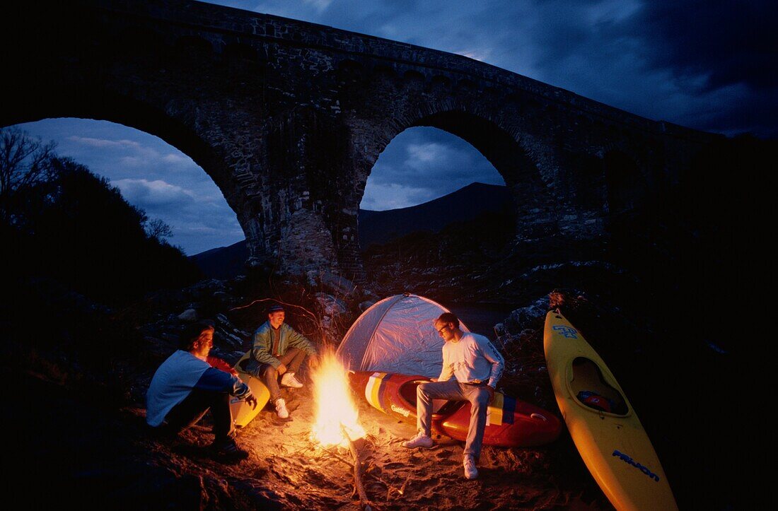 Canoeist at campfire, Travo, Corsica, France