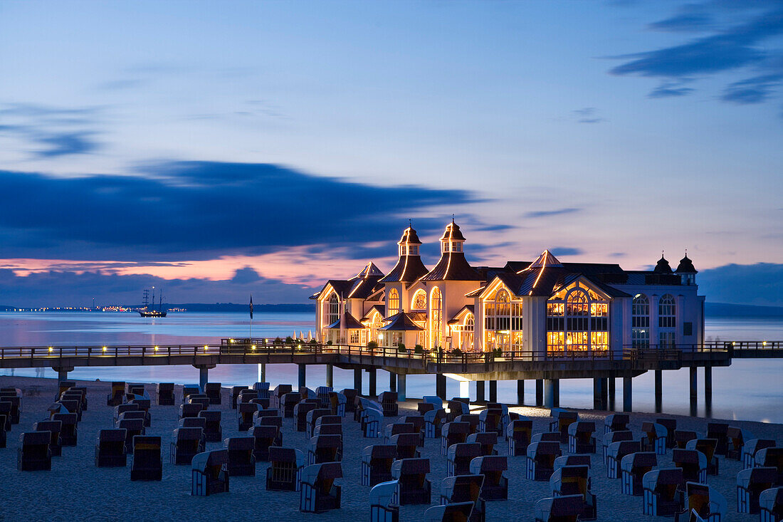 Sandy beach with beach chairs, pier in background, Sellin, Rugen island, Mecklenburg-Western Pomerania, Germany