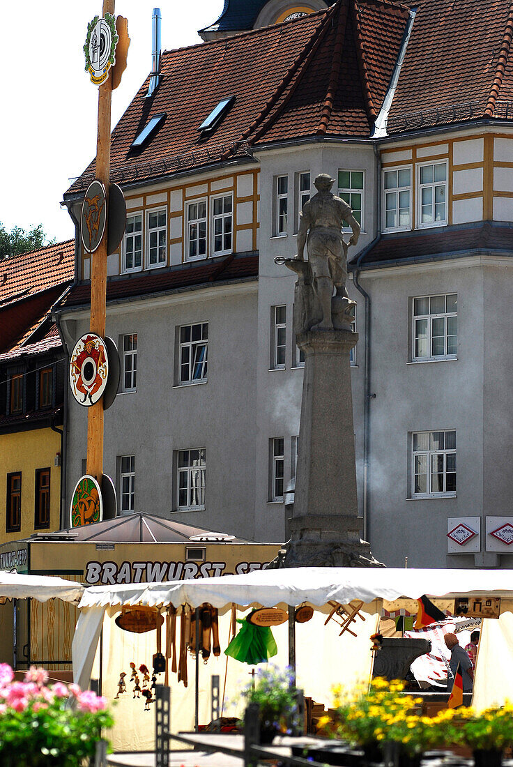Market square in Suhl with monument of weapon blacksmith, Thuringia, Germany