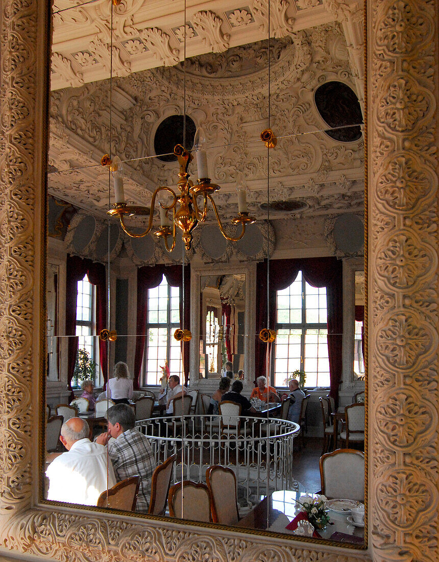 Reflection of a cafe in Hessensaal of castle Elisabethenburg, Meiningen, Thuringia, Germany