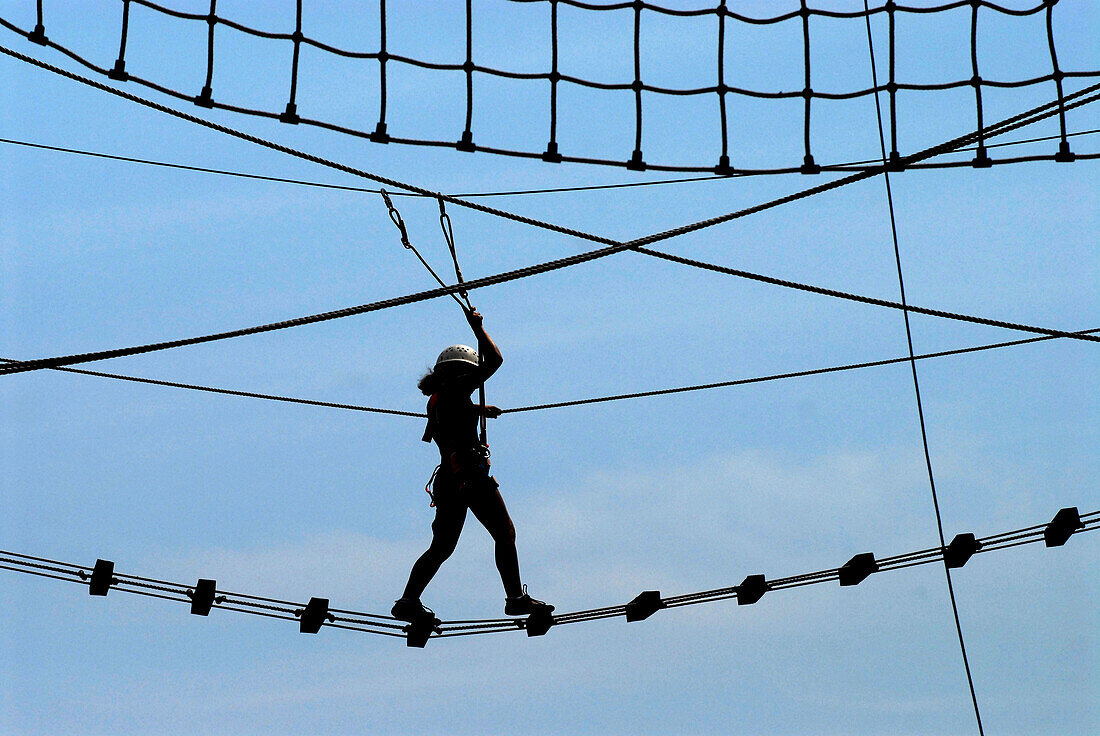 Climbers in ropes course, Steinach, Thuringia, Germany