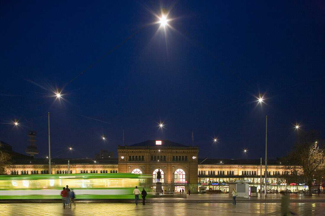 Tram passing railway station forecourt, Hanover central station, Lower Saxony, Germany