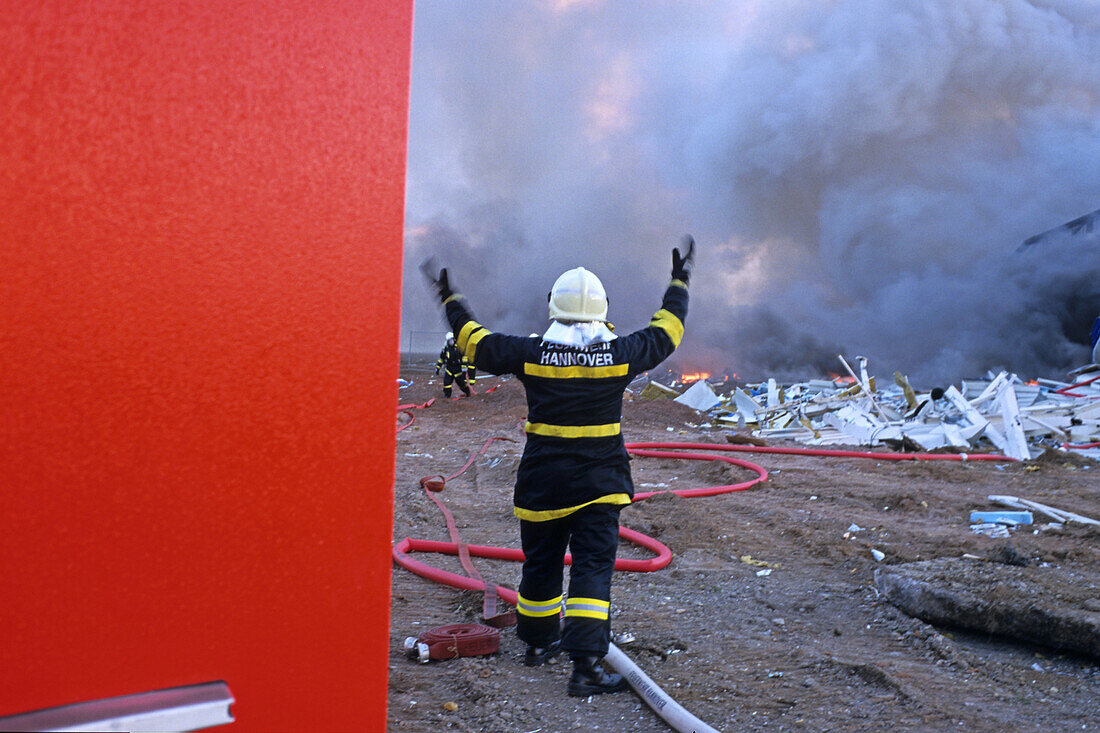 Firefighter throwing a hose, Hanover, Lower Saxony, Germany