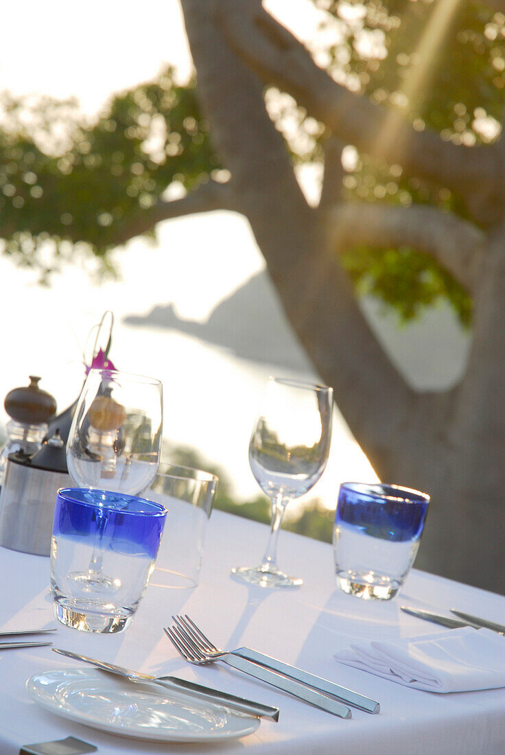 Table with table settings at pool restaurant and sea view, Hotel Pimalai, Ao Kantiang, Ko Lanta, Krabi, Thailand
