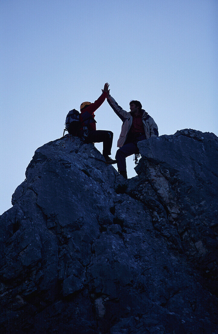Two people at the summit of a mountain, Zugspitze, Garmisch, Upper Bavaria, Bavaria, Germany