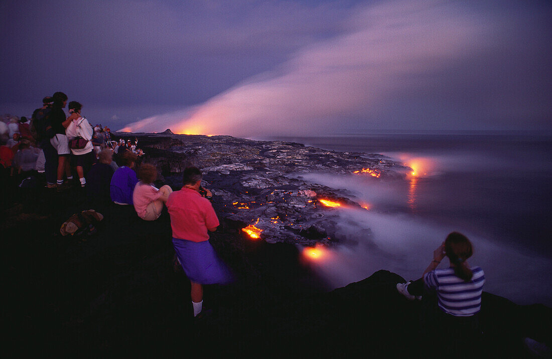 Lava flow at night, Pu'u O'o crater, flowing into the sea near Kamoamoa, Kilauea, Big Island, Hawaii, USA