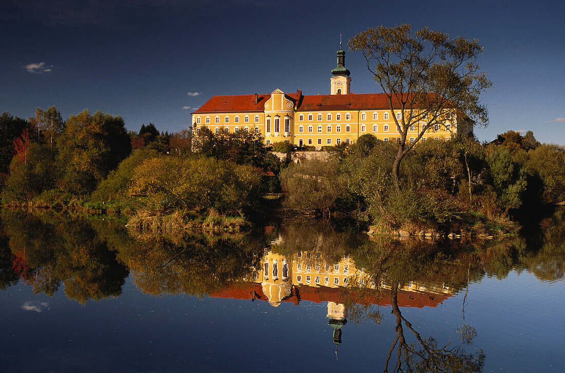 Calm waters of river Regen reflecting the former Cistercian abbey of Walderbach , Bavarian Forest, Upper Palatinate, Bavaria, Germany