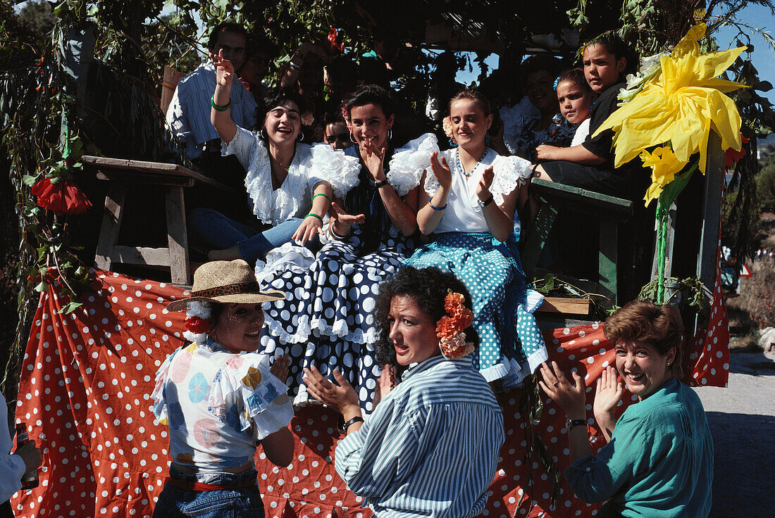 Pilgrims sitting in a covered Wagon, Romeria de Na. Sra. de Fuensanta, Coin, Malaga, Andalusia, Spain