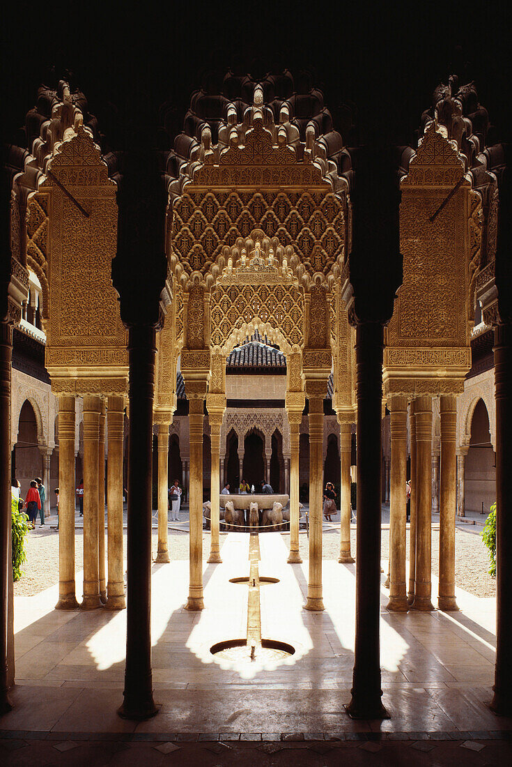 Courtyard of the Lions with fountain and arcades in the Moorish palace Alhambra, Granada, Andalusia, Spain