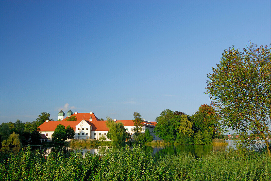 Monastery of Seeon in lake Seeoner See, Chiemgau, Upper Bavaria, Bavaria, Germany