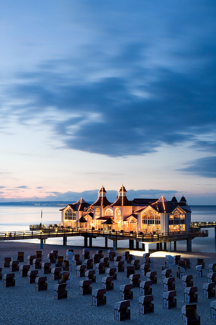 Sandy beach with beach chairs, pier in background, Sellin, Rugen island, Mecklenburg-Western Pomerania, Germany