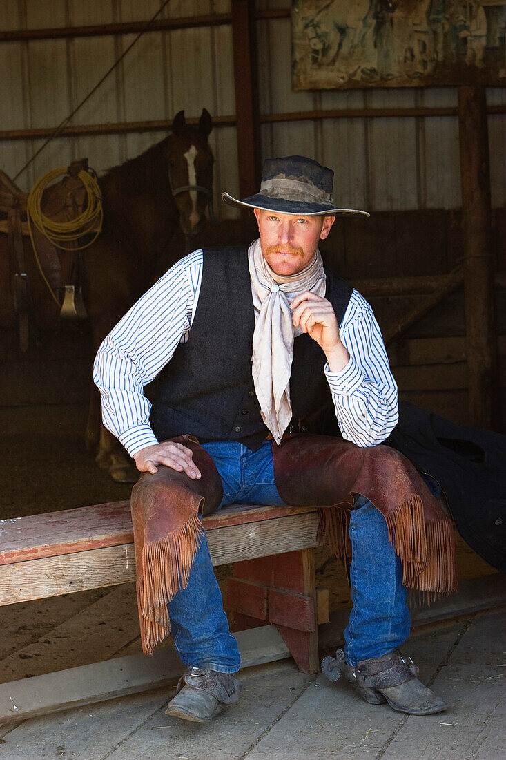 cowboy in stable, wildwest, Oregon, USA