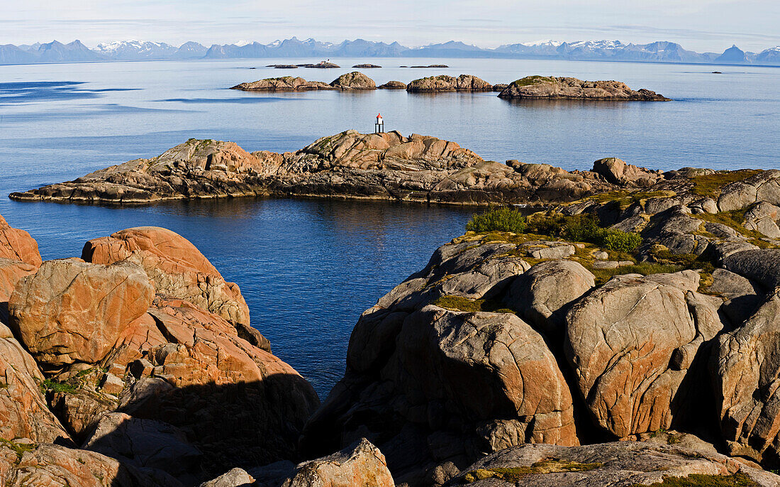 View of the skerry coast of Kalle, Norwegan mainland in the background, Austvagoya Island, Lofoten, Norway