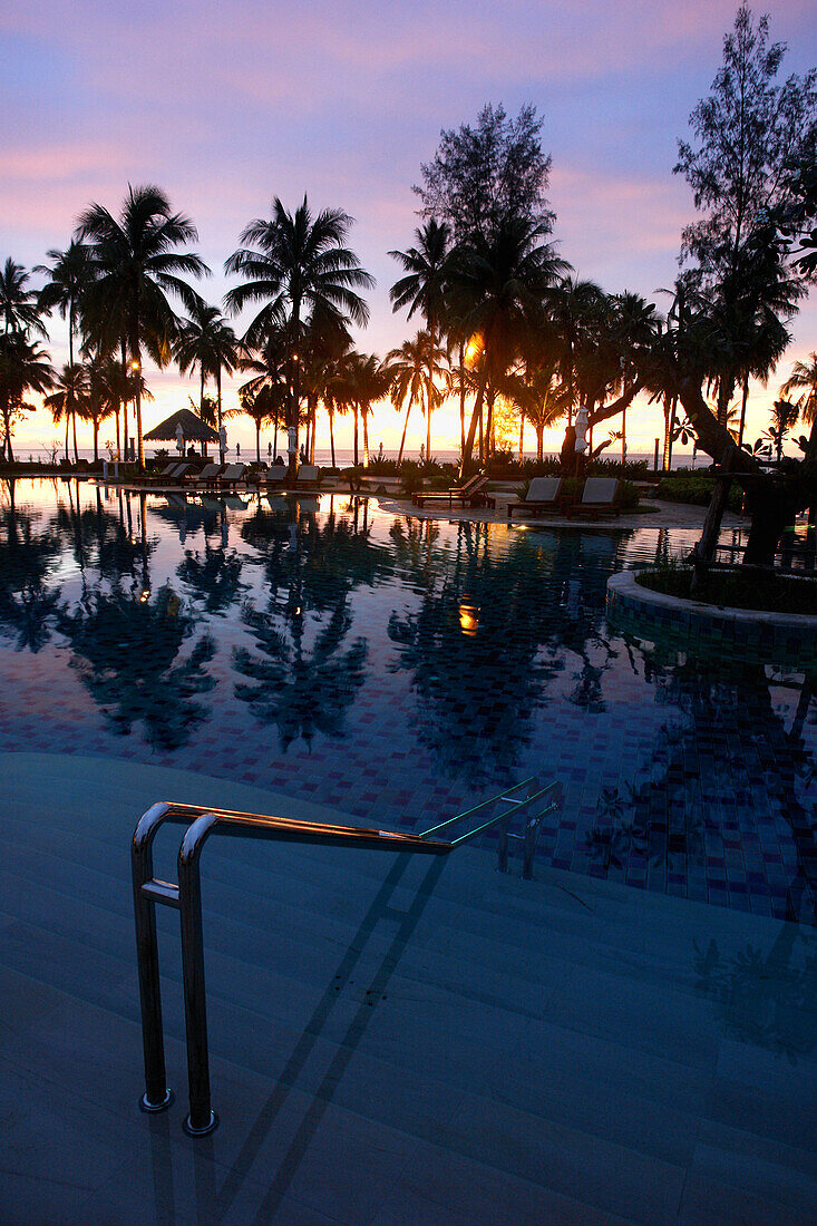 Hotel pool in Khao Lak at sunset, Thailand, Asia