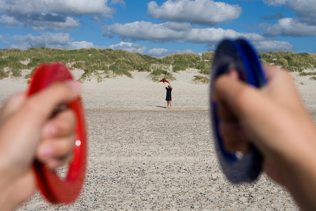 Fahter and son flying a kite at beach, Sylt island, Schleswig-Holstein, Germany