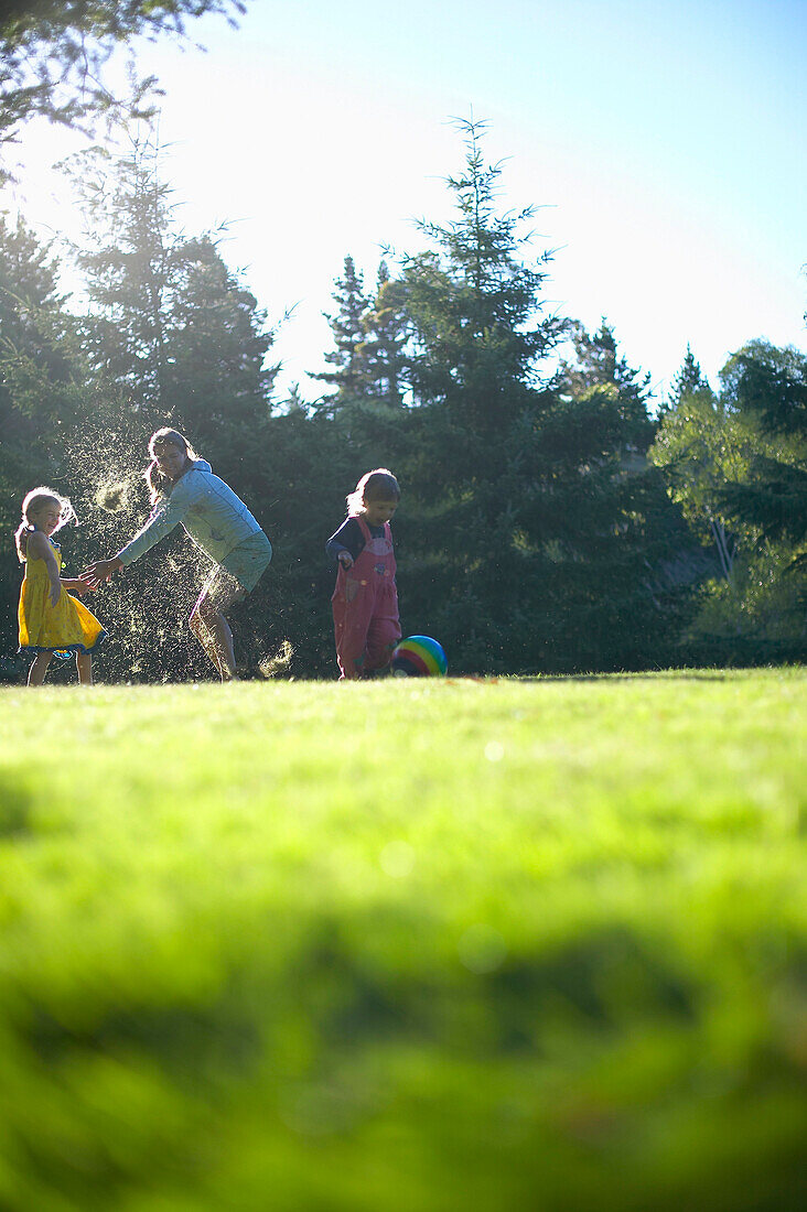 Mother and daughters playing ball, Braunlage, Harz mountains, Lower Saxony, Germany