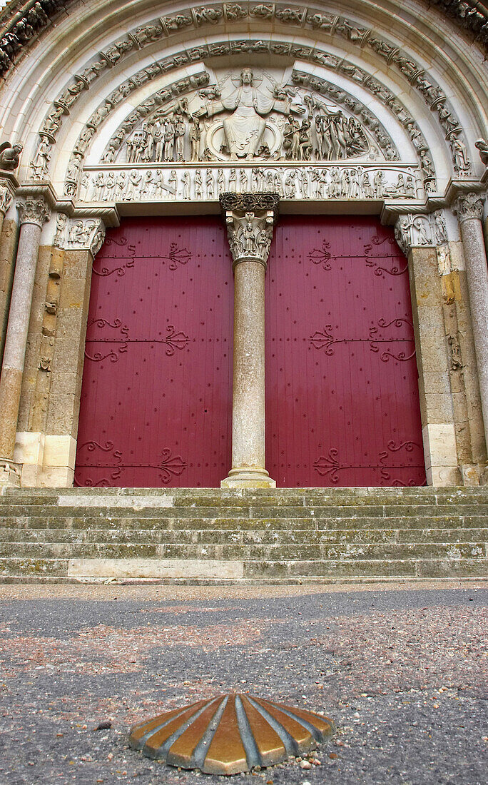 Main junction for pilgrimage routes, Camino de Santiago, a scallop shell marks the floor, outer main portal of the former monastery church of St. Madelaine, Vezelay, Department Yonne, France