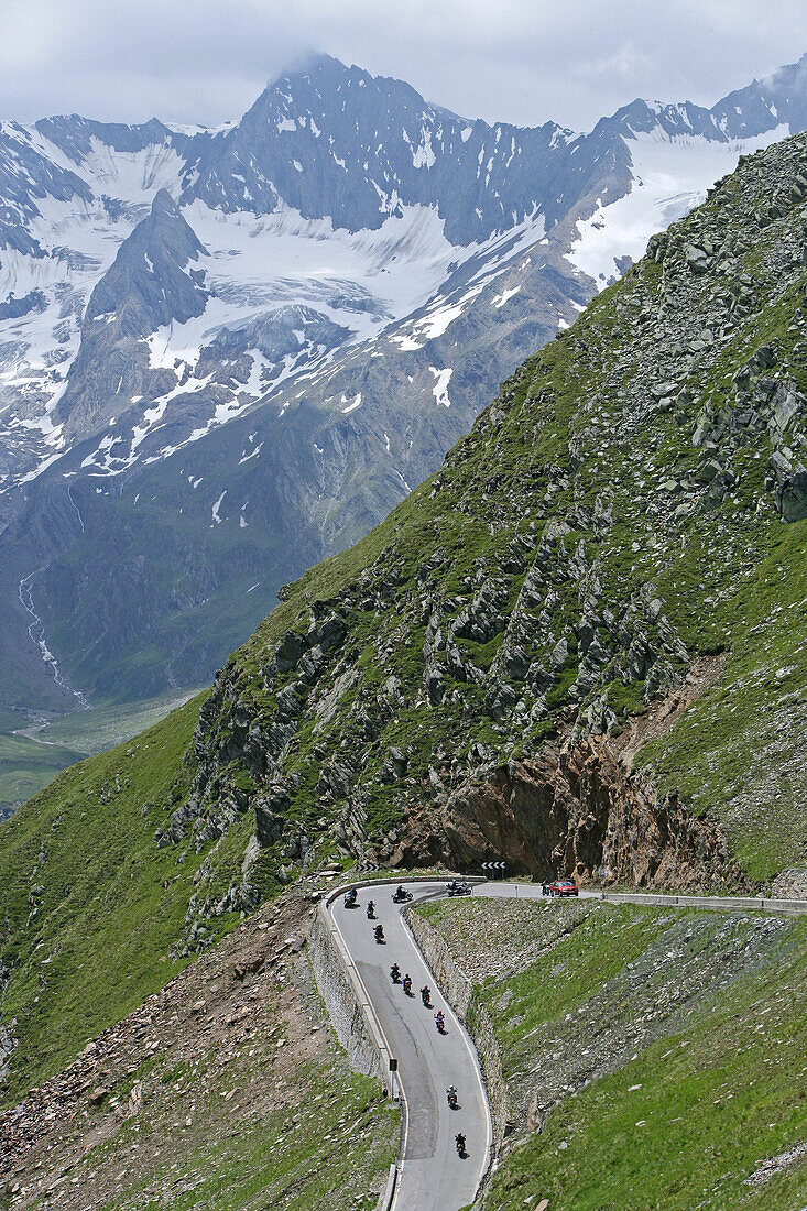 Motorbike tour in June over alpine passes, border pass at Timmelsjoch between Austria and Italy
