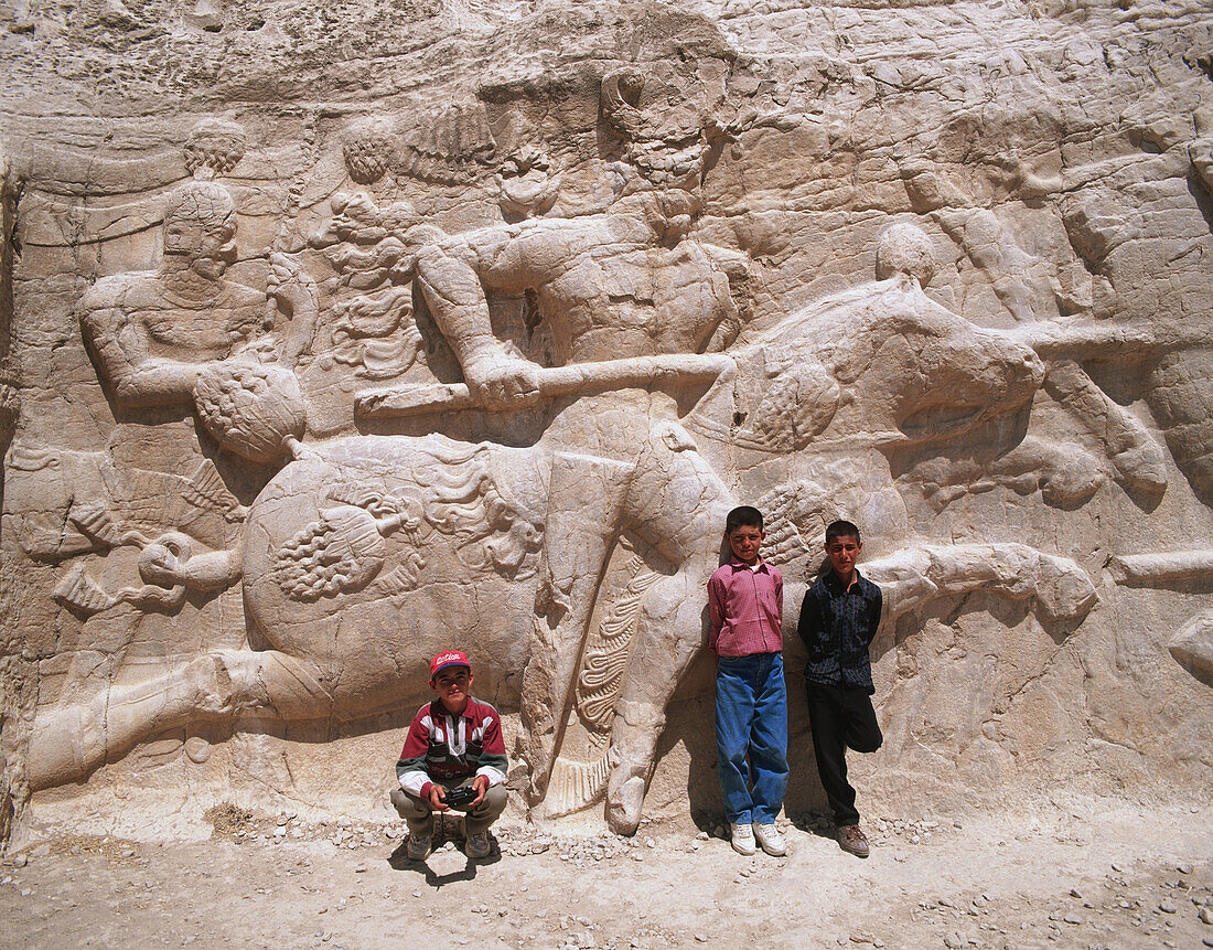 Children at the Achaemenian tombs. Naqsh-e Rostam. Iran