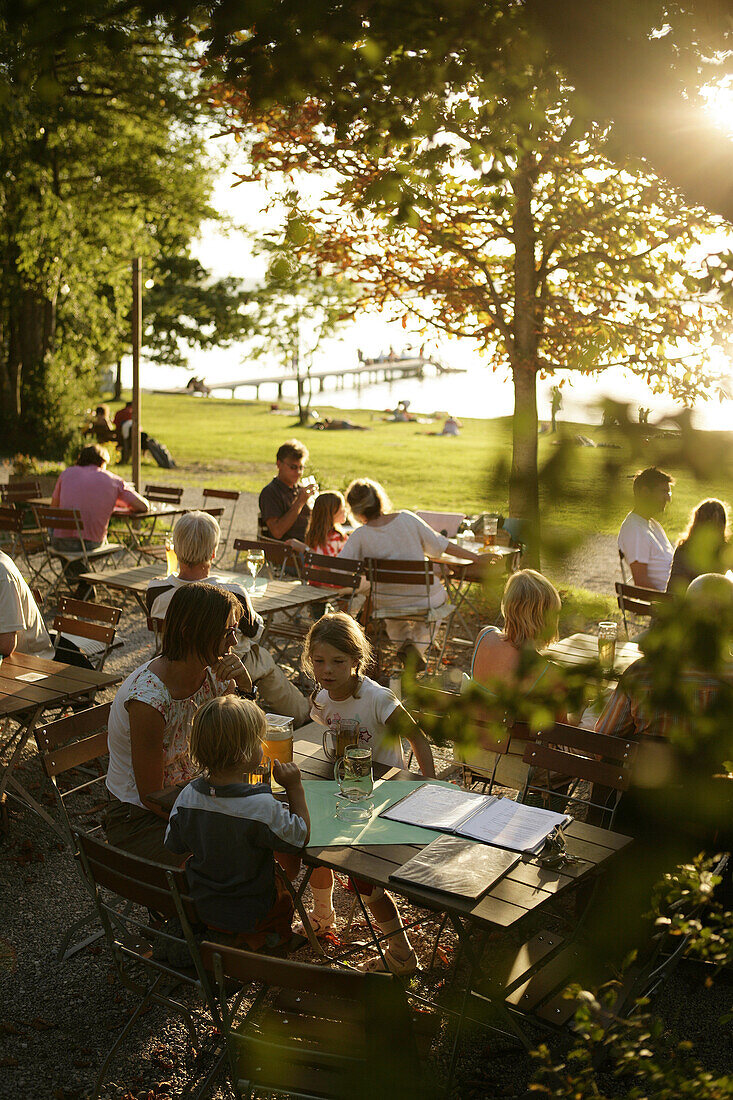 Guests in the garden of restaurant Buscharner, Buchscharn, Lake Starnberg, Bavaria, Germany