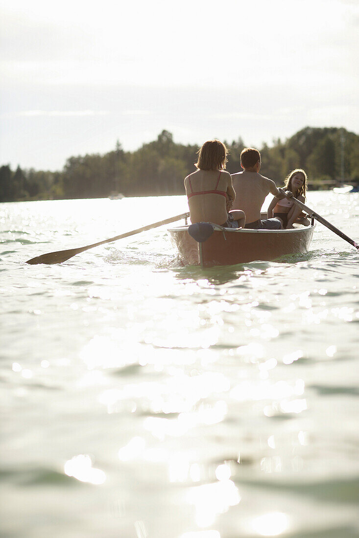 Family in a rowing boat, Lake Woerthsee, Bavaria, Germany, MR