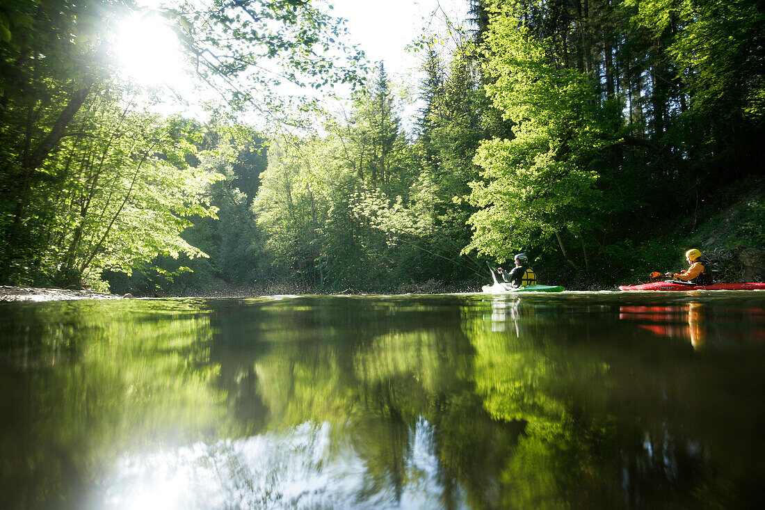 Two people, participants on the Mangfall river, kayak weekend for beginners on the Mangfall river, Upper Bavaria, Germany