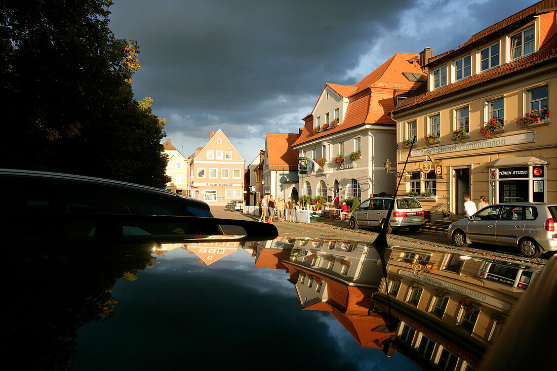 View of the town reflected on a car, Schluesselfeld, Franconia, Bavaria, Germany