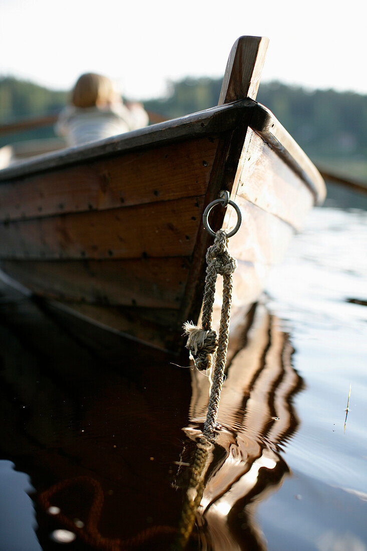 Boy (3-4 years) in a rowboat on Lake Staffelsee, Upper Bavaria, Bavaria, Germany, MR