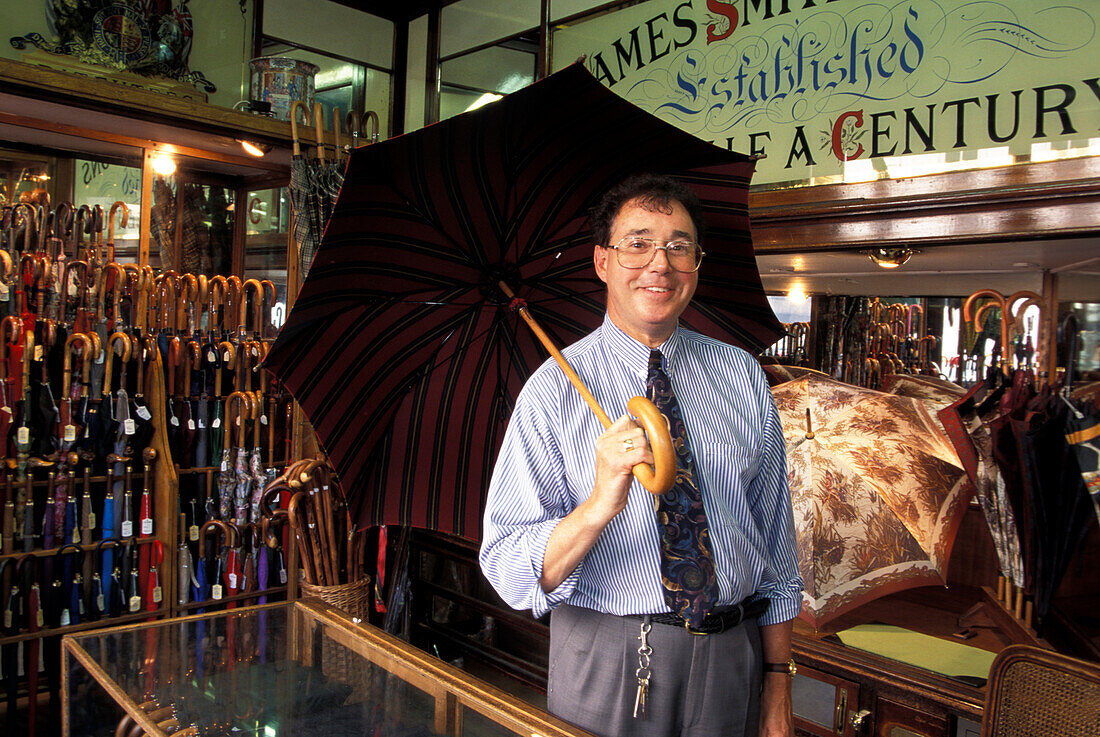 Man with umbrella, James Smith and Sons Umbrella Shop, London, London, England, United Kingdom