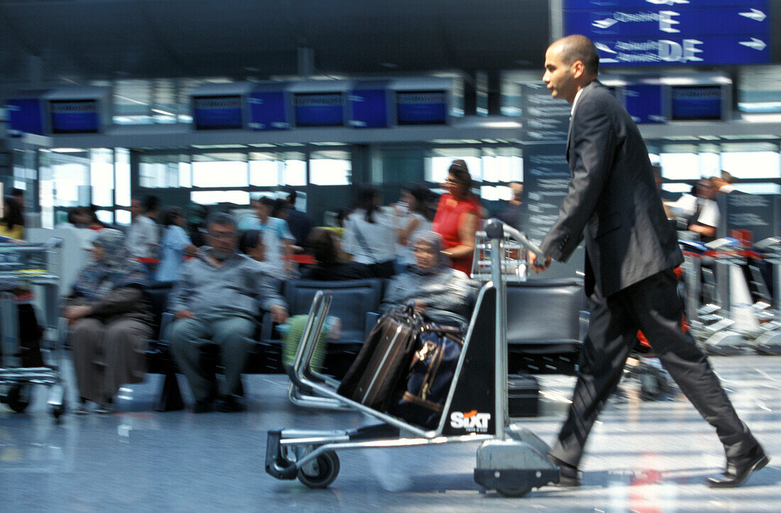 Businessman at airport, Frankfurt Airport, Frankfurt, Hesse, Germany