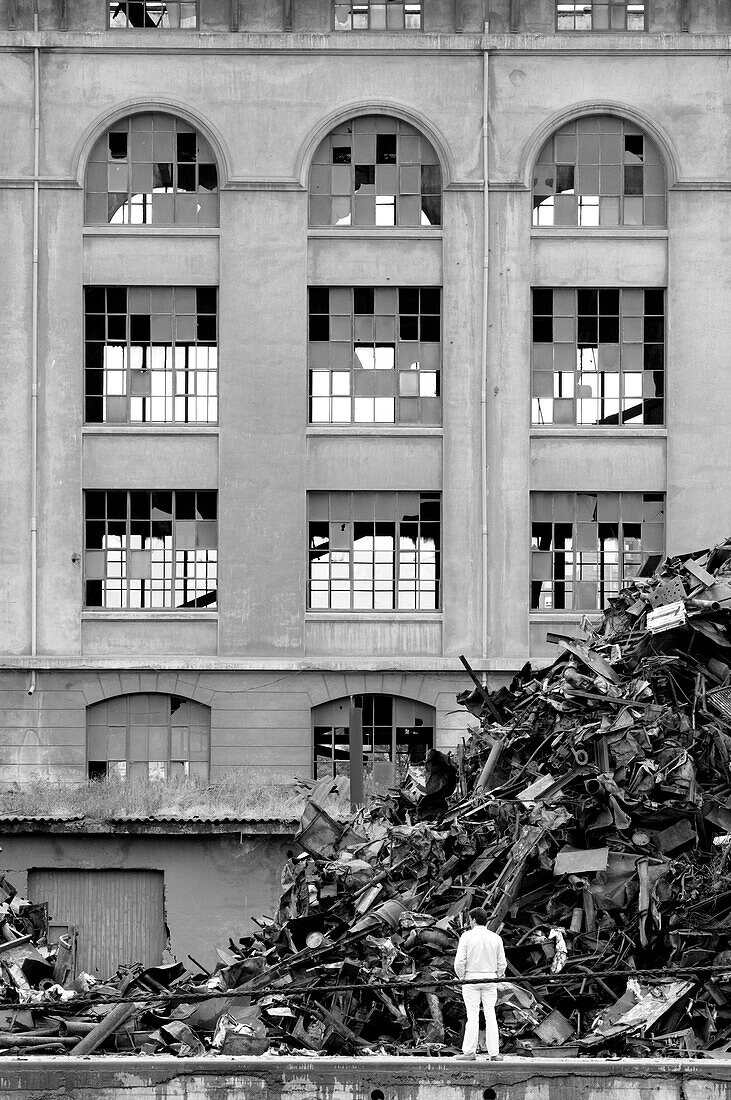 Scrap iron in front of derelict facade, Bilbao