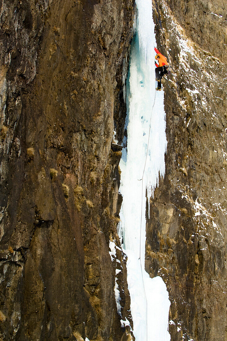 Ice climber on icefall, Iceland