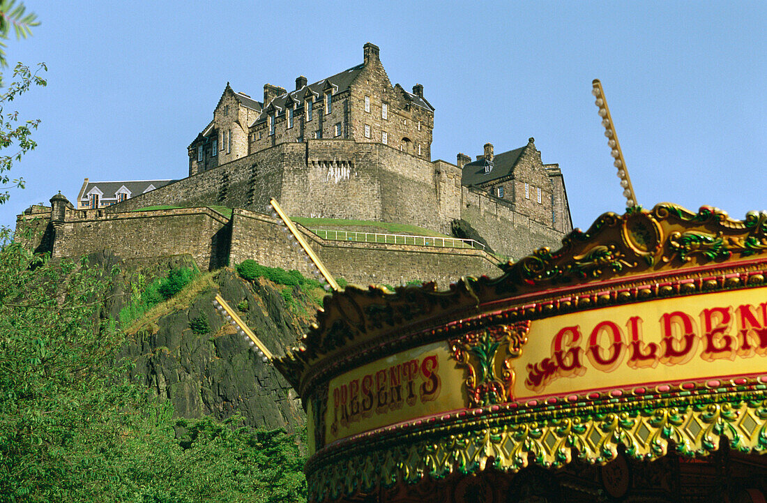 Merry go round and Edinburgh Castle. Edinburgh. Scotland