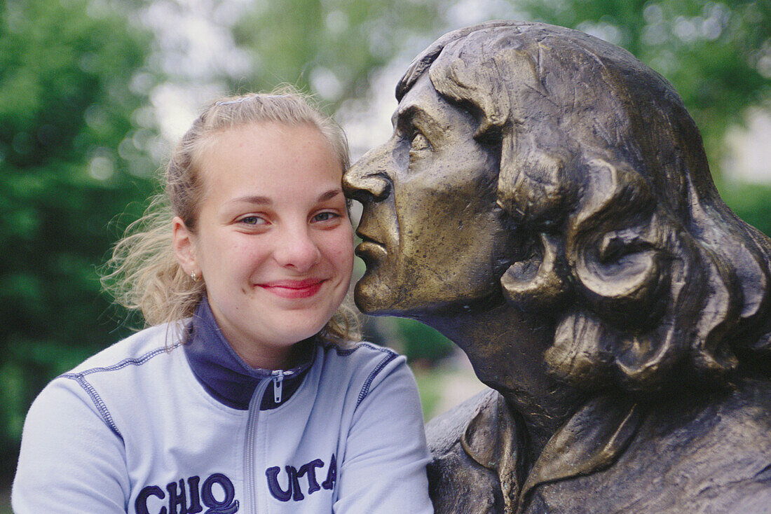 Nicolaus Copernicus statue with girl. Olsztyn. Poland