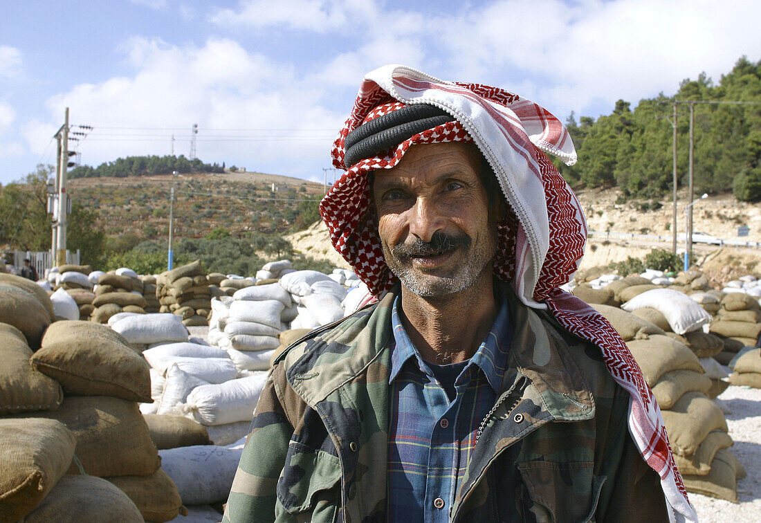 Worker at the olive oil factory. Jerash, Jordan