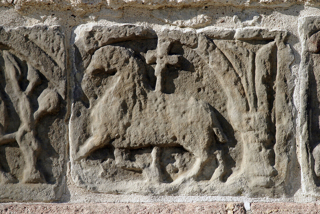 Horse relief with cross on a limestone wall on Vamlingbo medieval church. Gotland, Sweden