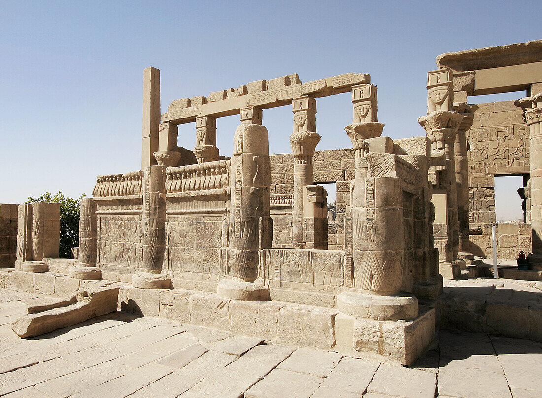 Part of Philae temple with faces on top of the columns. Isis temple. Aswan. Egypt