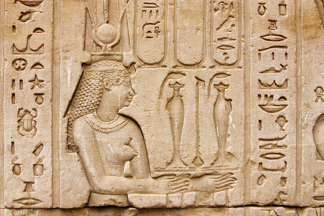 Stone relief of Isis at the temple of Horus in Edfu. Egypt