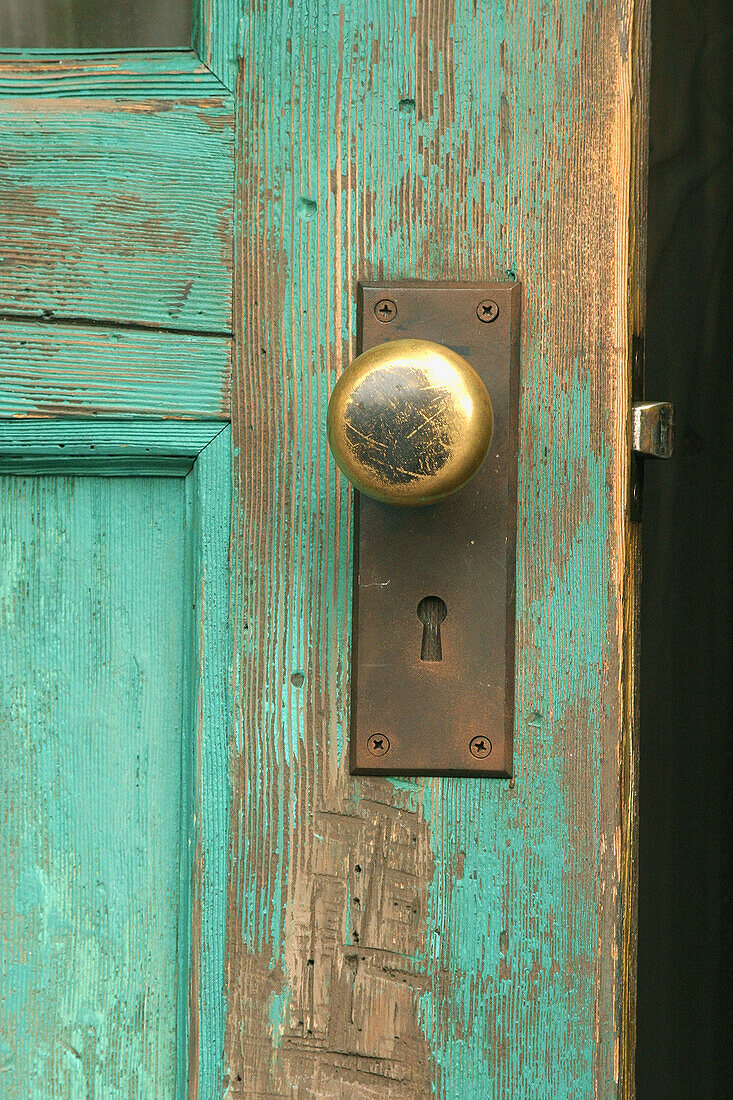 Door knob on wooden door.