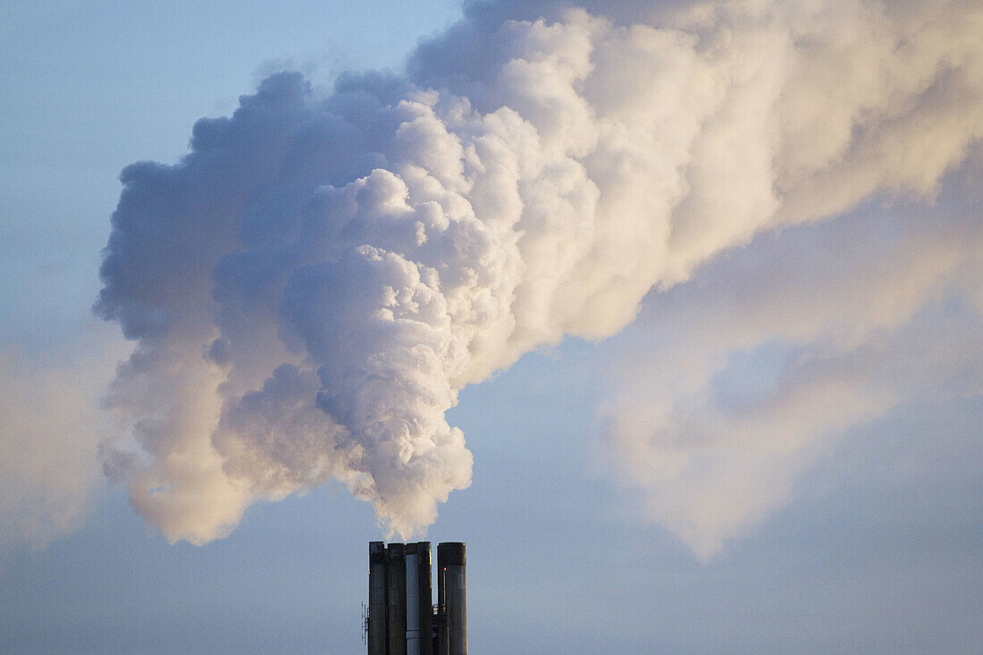 Chimney on district heating plant in Uppsala. Sweden. Winter morning.